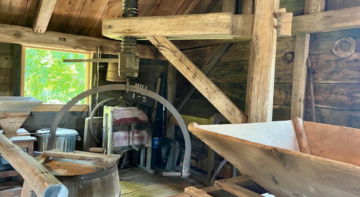 A photograph of the interior of a historic grain mill.