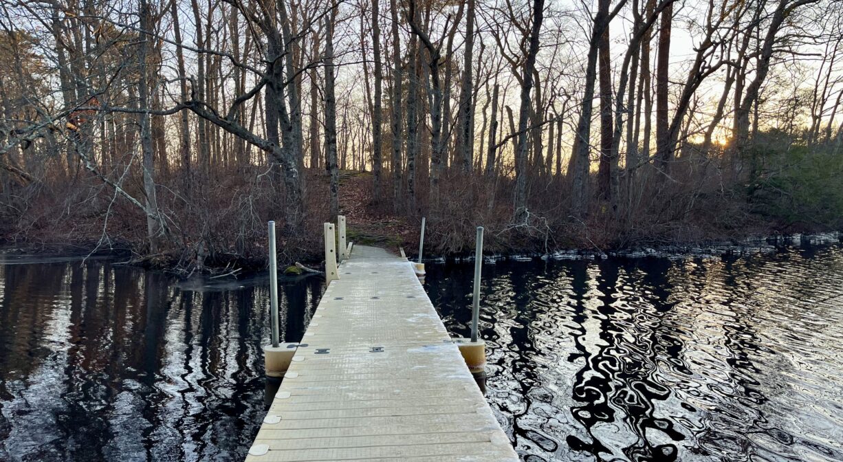 A photograph of a walkway leading to an island.