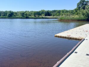 A photograph of a dock and float on a river.
