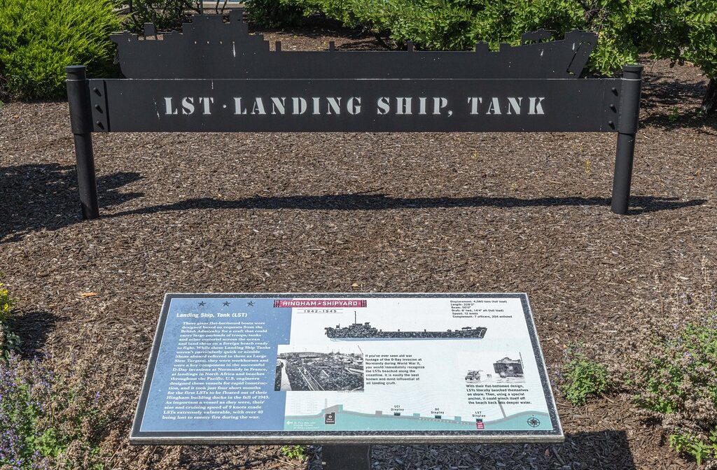 A photograph of an interpretive sign in a park.