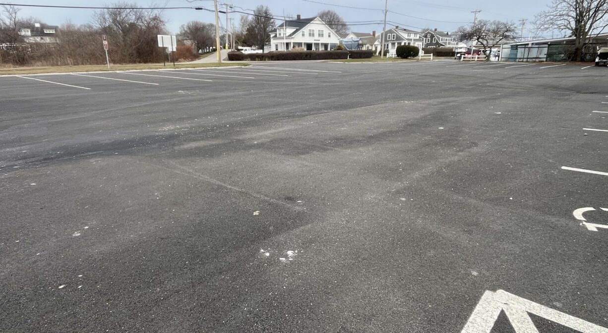 A photograph of a large paved parking area.