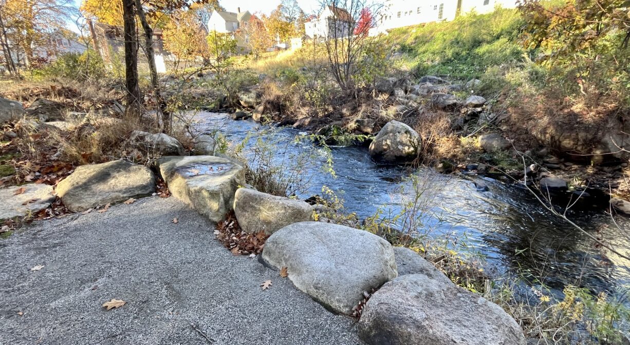 A photograph of an observation area beside a river.
