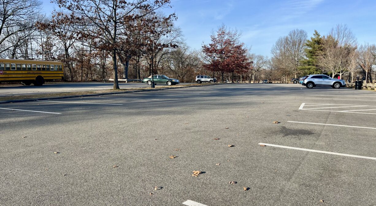 A photograph of a large paved parking area.