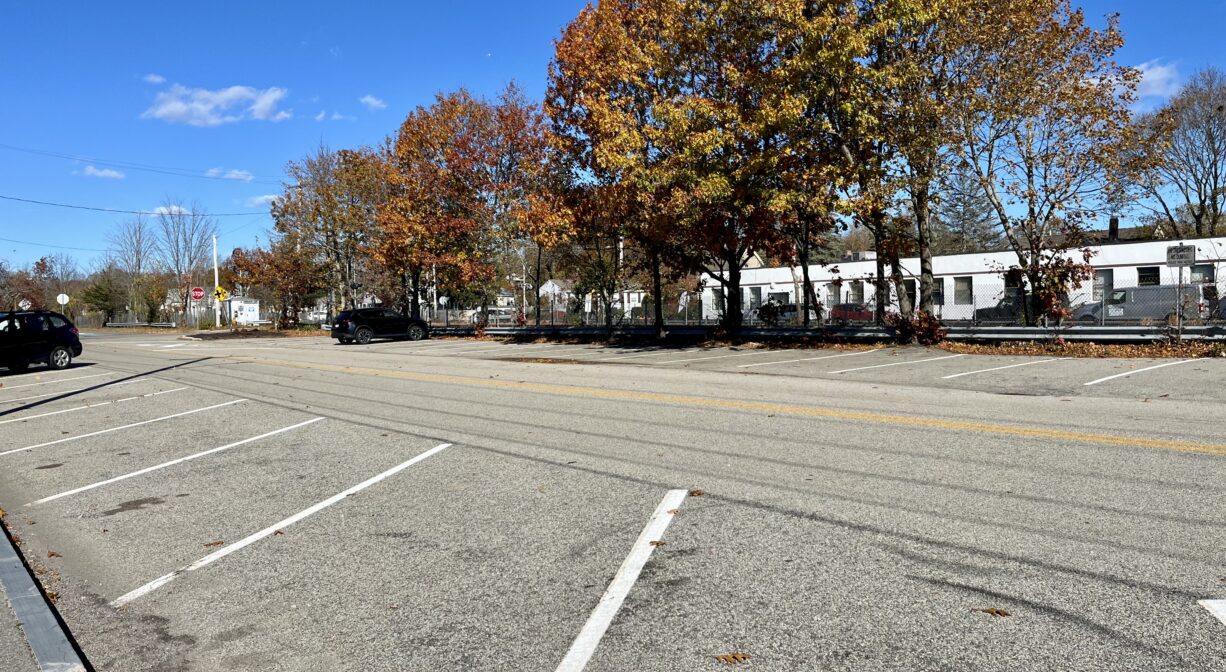A photograph of a large paved parking area.