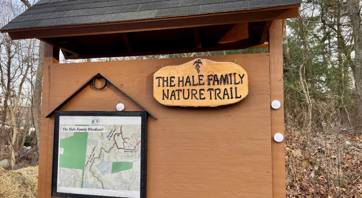 A photograph of a property sign with a map.